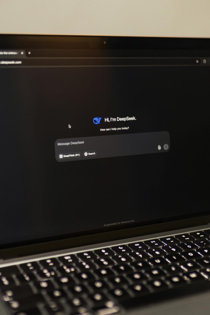 Image of a laptop showing an interactive AI interface with DeepSeek application.
